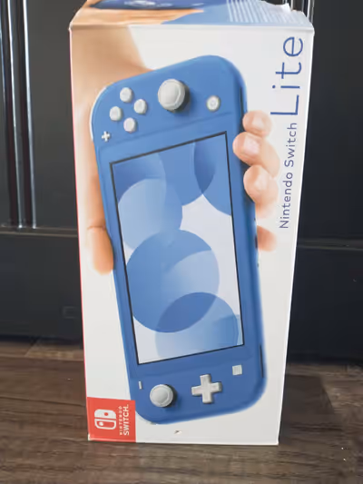 Dive into portable gaming with this excellent, like-new Nintendo Switch Lite in a cool blue hue, bun...