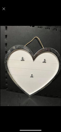 Like new heart shaped photo frame with clips