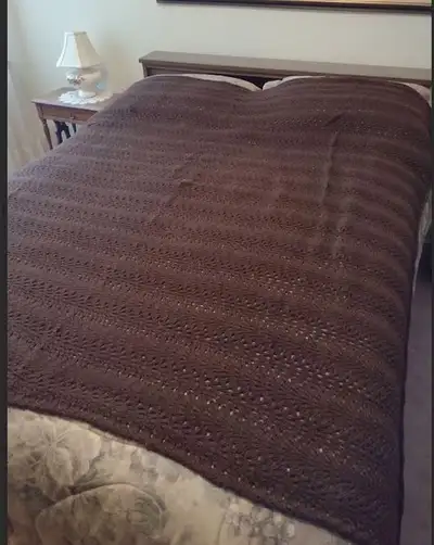 Knitted brown throw, View more