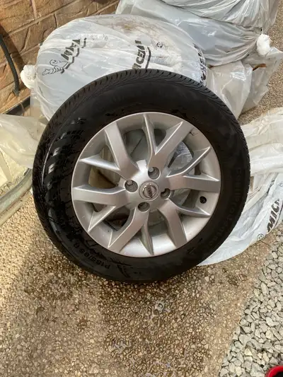 Nissan rims with all season Continental tires P185/65 R 15