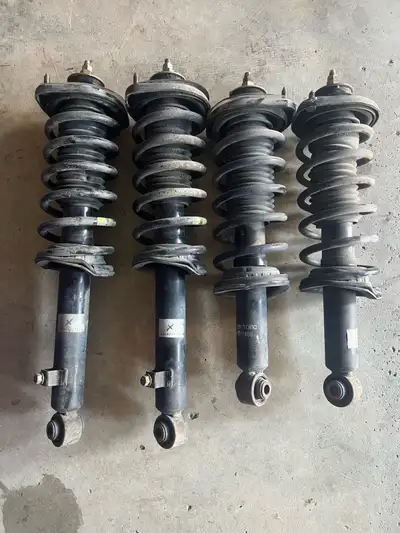 In good condition factory front and rear strut assembly