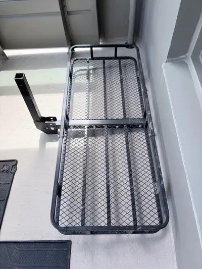 I'm selling a hitch mount cargo carrier, complete with a waterproof bag and locking straps, ensuring...