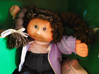 1980s CABBAGE PATCH DOLL, PURPLE JACKET, BROWN YARN PIGTAILS BOX