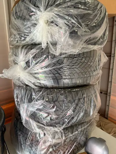 Selling a set of four nearly new winter tires, size 235/45R18, perfect for a Tesla Model 3 or any ve...