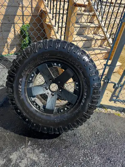 4 Goodyear Wrangler LT Duratrac 315/70/R17 on dodge ram sport rims Tires are lightly studded there l...
