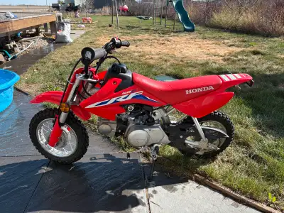 Selling my sons 2022 crf50 as he has out grown it. Good condition. No more then 15 hours on this uni...