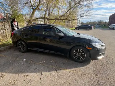 This sleek black Honda Civic is ready to turn heads with its stylish design and reliable performance...
