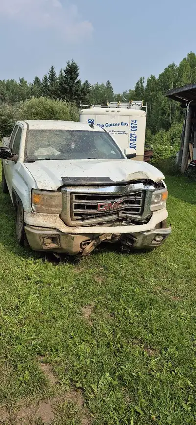 2015 GMC, 4 / 4 hit a tree. However, motor transmission rear end is all strong. Runs like a charm. I...