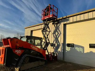 Work safely and be more productive with a scissor lift and your skid steer. Work on uneven terrain a...