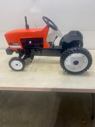 ALLIS CHALMERS 7080 PEDAL TRACTOR. CUSTOM FEATURES: FRONT WEIGHTS - WHEELS - GEAR SHIFT.
