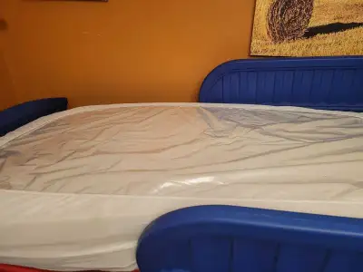 Like new mattress,plastic on the bed ,good for toddler just starting in a bed,call to view or pick u...