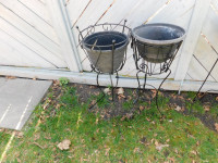 A PAIR OF WROUGHT PLANT HOLDERS