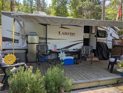 For sale, 2014 Laredo, 27 ft couples trailer. 2 slides, kitchen island. Big bathroom with lots of st...