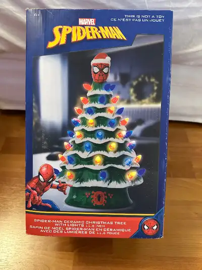 For sale is a brand new never used Marvel spider-man ceramic Christmas tree with lights.