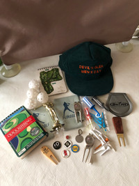 Lot of golf related accessories as shown