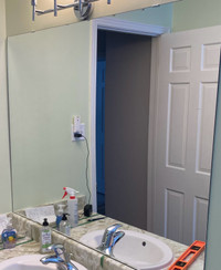 Large frameless mirror