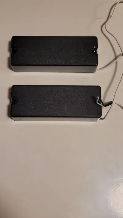 A pair of passive 5 string bass soapbar type pickups, from an Ibanez Like new will ship at buyers ex...