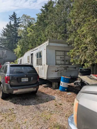 50 foot from the tip of the tongue to the back wall. Was used for storage. Roof has couple of small...
