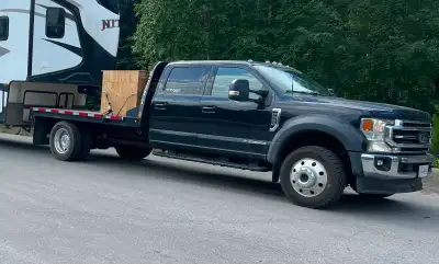 Selling my 2022 crew cab flat deck truck. Originally purchased to haul a camper, but the camper has...