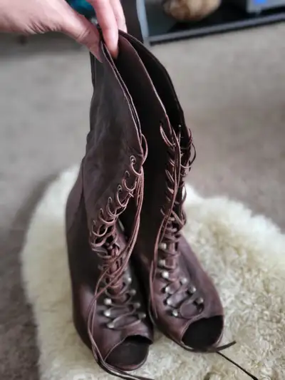 CHOCOLATE BROWN LEATHER MID CALF BOOT HAS A HEEL LACE UP BOOT