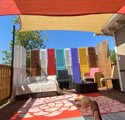 Large top floor bedroom has private ensuite bathroom with custom shower. The room has a queen bed, d...