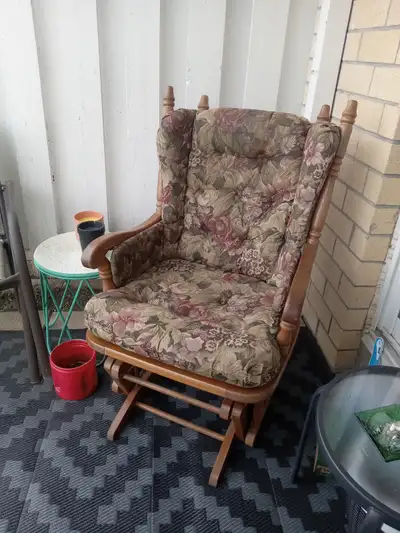 Vintage Dutailier gliding chair with cushions., View more