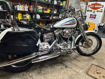 35th anniversary dyna. 60,000 km, very clean. Runs mint. #2435 of 3500 made. Quick detach sissy bar...