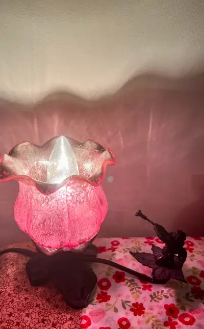 Trumpeting Cherub Tulip Lily Accent Lamp. Made of handblown pink mercury glass atop a metal base. La...