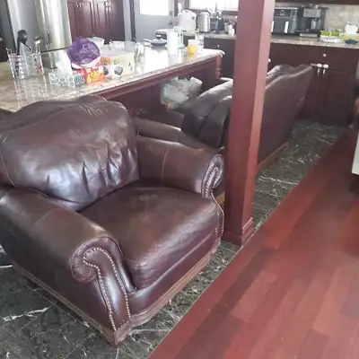 Fauteuil en cuir  $250 et causeuse  $300 / Leather chair  and  s, View more