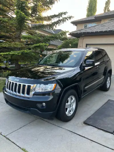 This 2011 Jeep Grand Cherokee is a reliable and rugged SUV that has been well-maintained and remains...