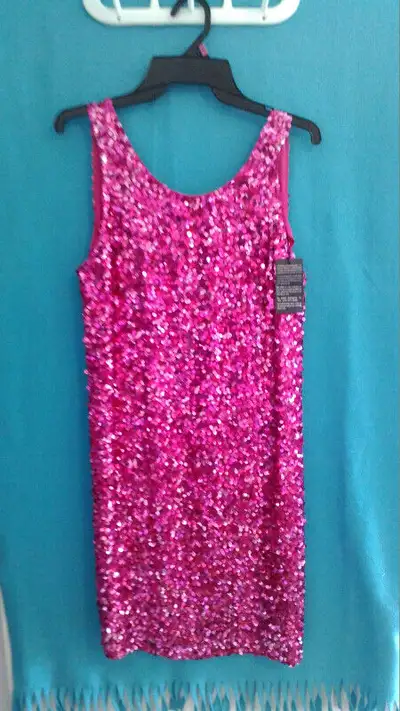 Hot pink sequins dress, pleather jacket, pink bag. ostrich scarf, View more