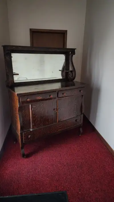 Antique sideboard / buffet from the early 1900's. Has wheels .Very solid. $300 obo.