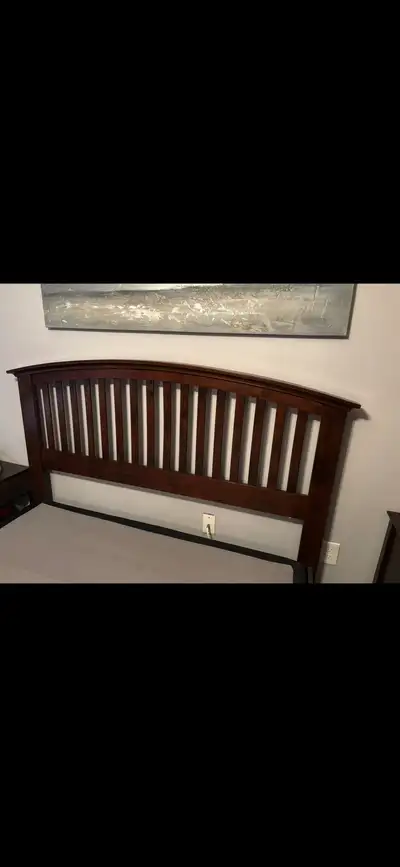 Upgrade your bedroom with this elegant queen-sized bed frame and matching nightstand. This used set...