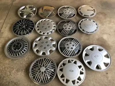 14 assorted old/vintage plastic hubcaps and 102 L plastic storage tub. I want to sell it all as one...