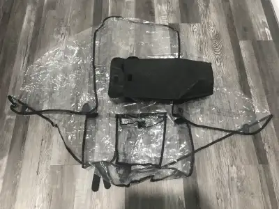 Stroller rain shield. New. Comes with its own bag.