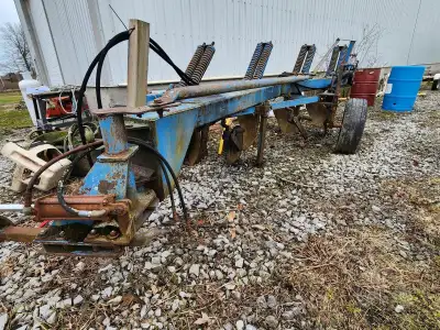 Ford/NH 4 bottom moldboard plow. Heavy Duty semi mounted frame with spring trash clearance. $800 CAD...