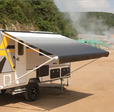 12'x8' retractable rv awning (non-motorized) by Aleko. White frame with white/black fade on fabric....