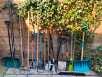 Gardening tools shovels rakes wheelbarrow hedge trimmer