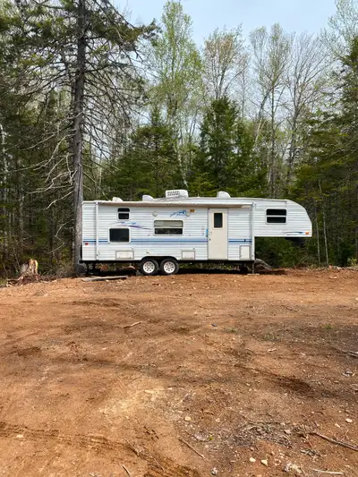 2000 fifth-wheel RV for sale. Slight water damage in the back corner. No MVI. 4 tires hold air, hook...