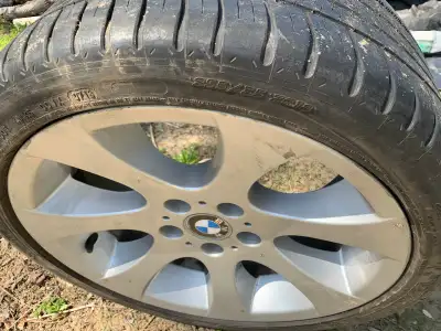 Used BMW rim with tire, sized at 255/55R18, which would be great for anyone needing a replacement or...
