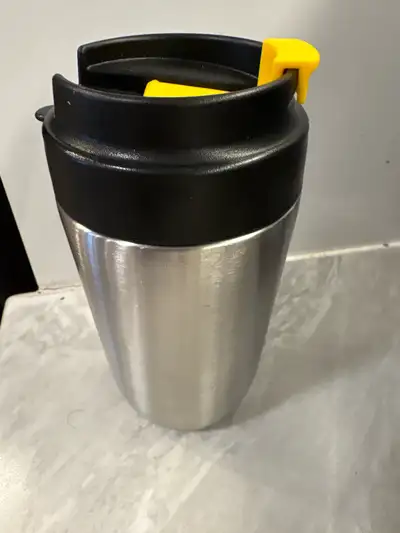 This IKEA travel mug is perfect for anyone who loves to take their coffee or tea on the go, featurin...