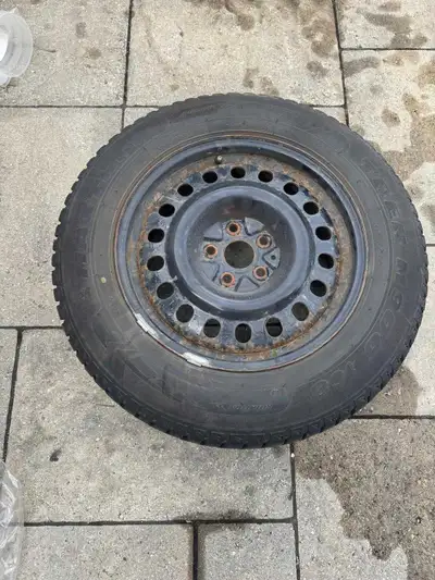 Four 225/65R17 snow tires with steel rims, used for two winters and in good condition