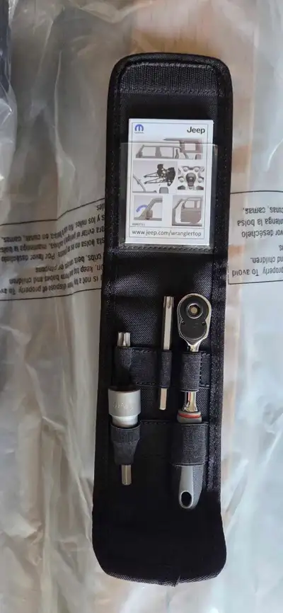 Jeep wrangler tool kit to getting naked. Tool never been used.