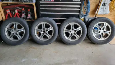 Selling a set of Mitsubishi aluminum rims and tires. 16" rims with 5x114.3 bolt pattern on Michelin...
