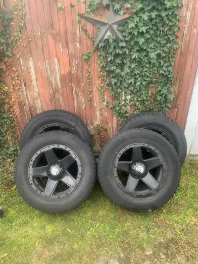 Bridgestone Blizzak dmv-2 tires size 285/60/R18 Set on rtx off road 18” rims. Approximately 4-5mm tr...