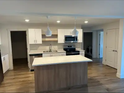 This top floor unit is modern and cozy. One of the bedrooms has extra large windows to allow for lot...