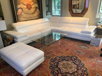 White Leather sectional couch and ottoman