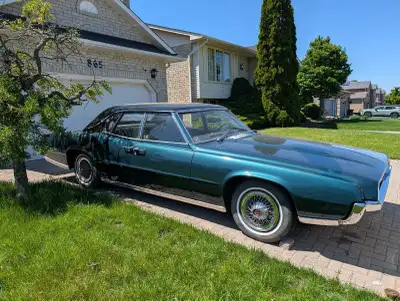 It's a 4 door Ford Thunderbird (suicide doors) . Quite rare for it's kind as quite an amount produce...