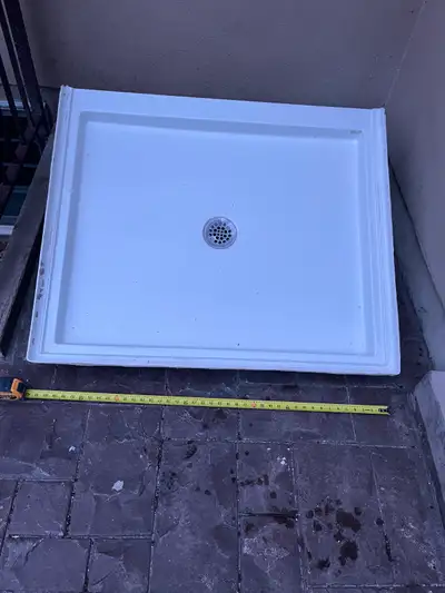 • For built in installation • 42” x 36” • White fiberglass. • Telephone style shower head included.
