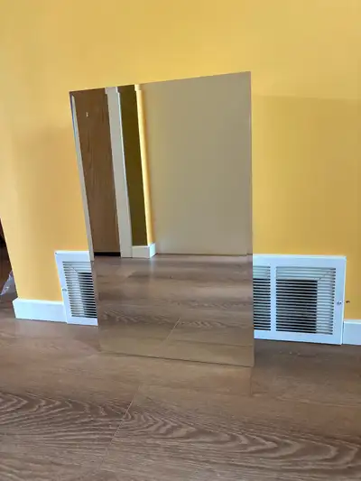 This pre-owned bathroom medicine cabinet features a sleek mirror front and a clean white interior, p...